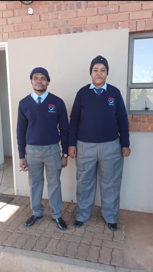 Two Triple S Security officers in uniform